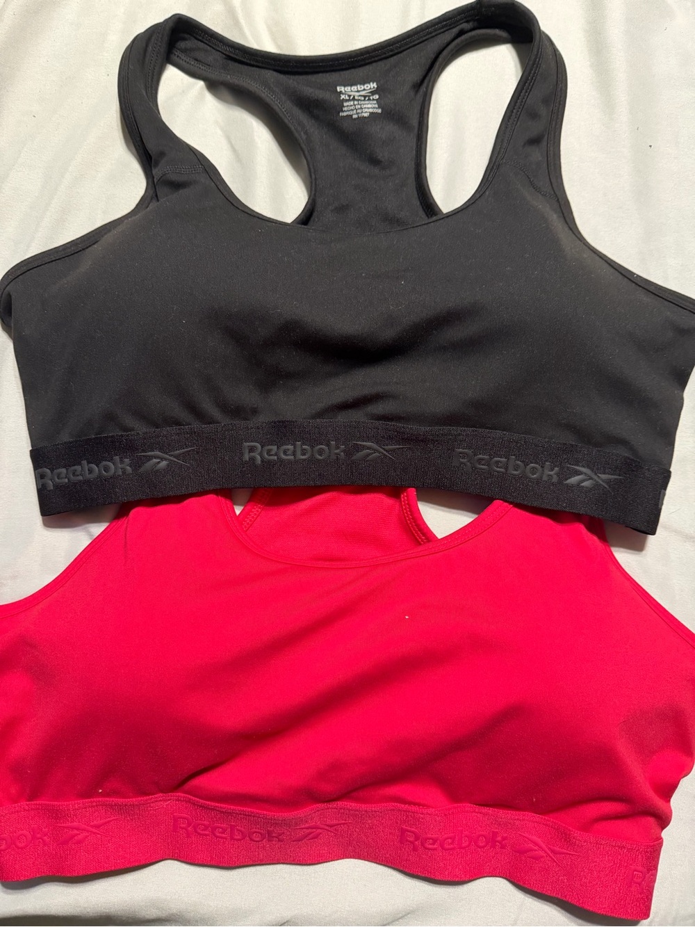 Reebok Racerback Sports Bras in Black and Bright Pink